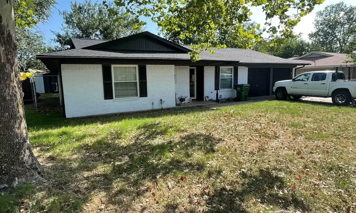Professional roofing crew working on a residential roof in South Huntingdon